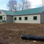 pole barn with metal roof and siding with windows