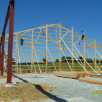 a crew working on pole barn construction