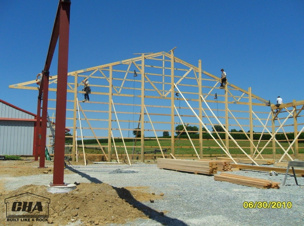 a crew working on pole barn construction