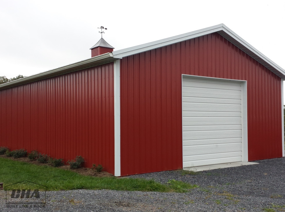 pole barn red with white trim and cupola